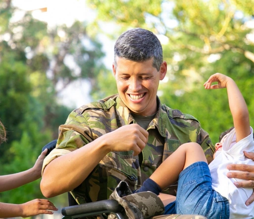 a disabled military veteran spending quality time with children in a park